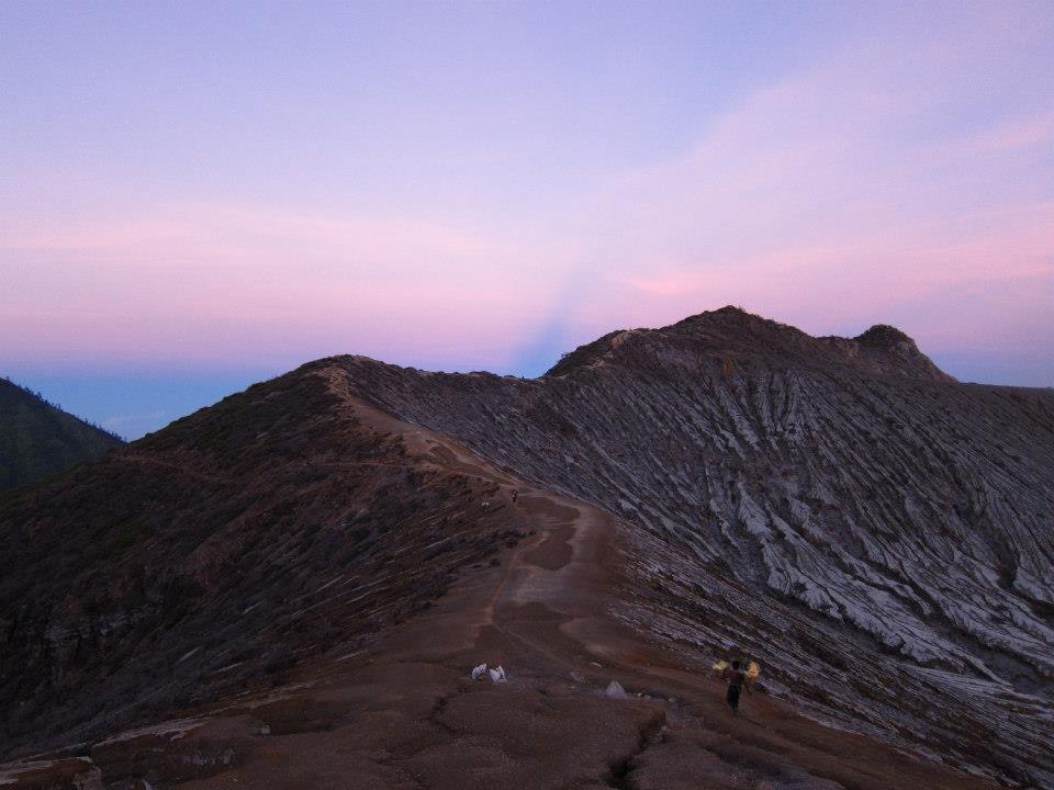 Sulphur miner walking across the mountain